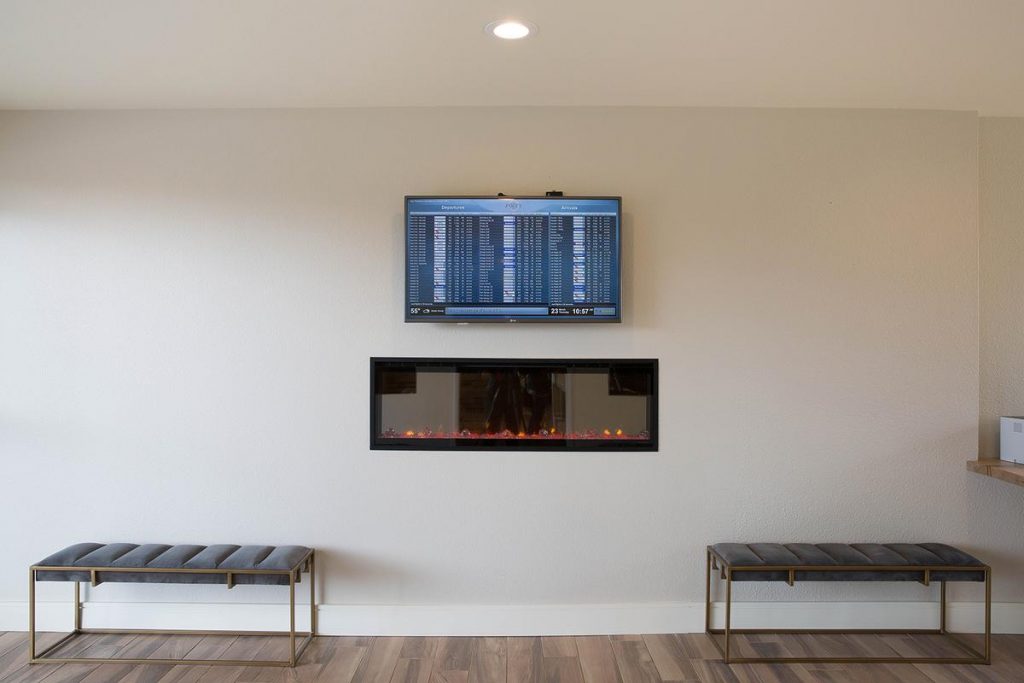 Hotel Focus lobby with fireplace and SFO flights list