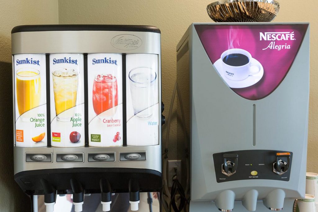 Drink machines in the breakfast area of Hotel Focus - Sunkist juice and Nescafe coffee