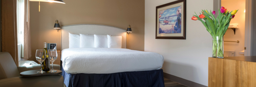 Hotel Focus SFO bedroom setup with flowers in the foreground