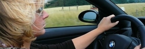 Interior shot of a lady driving a BMW